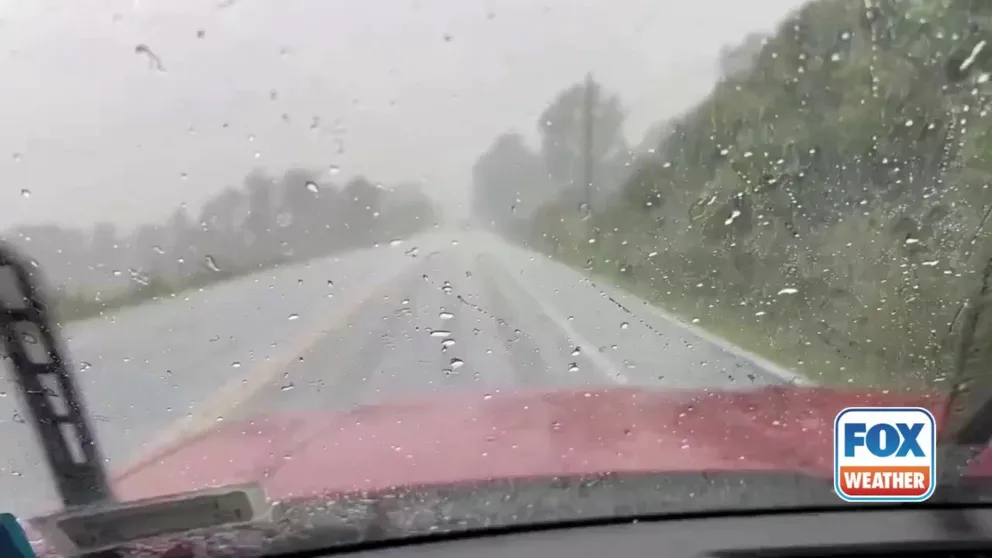 Video from Spafford, New York, shows hailstones and rain making for a wet drive Thursday afternoon. 