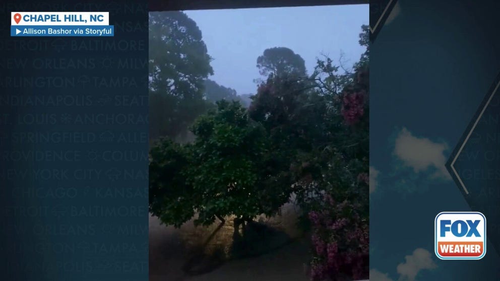 Firefighters perform water rescues in Chapel Hill, North Carolina on Sunday evening amid flooding caused by Tropical Depression Chantal's remnants.