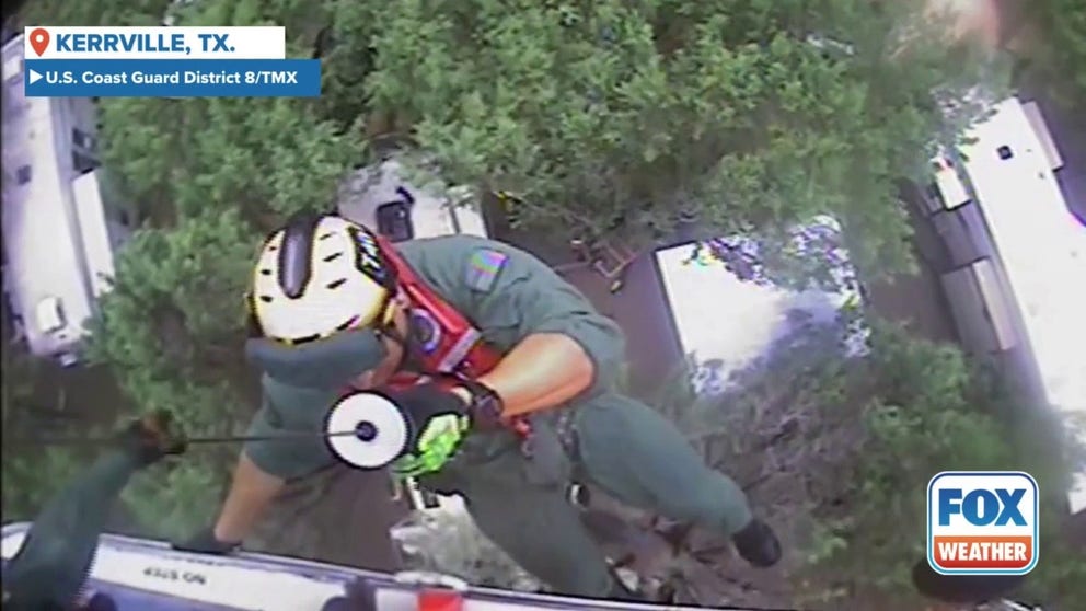 Video from the U.S. Coast Guard District 8 shows an aircrew rescuing a family near Kerrville, Texas after flooding surrounded their camper.