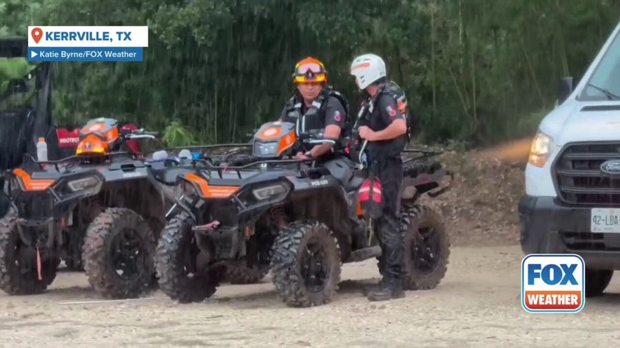 Texas search teams wait for rain to stop