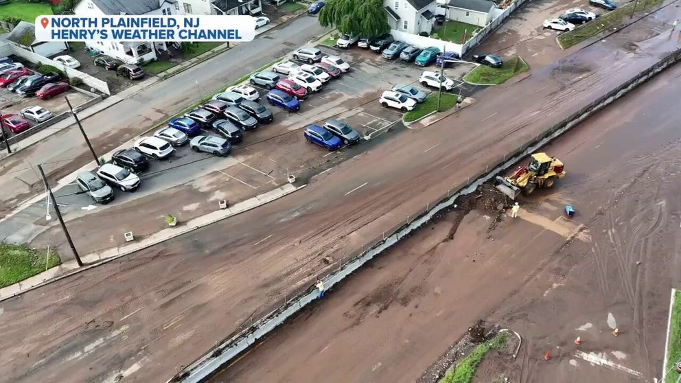 Thick sediment coated roads in North Plainfield, New Jersey, after flash floods devastated the area.