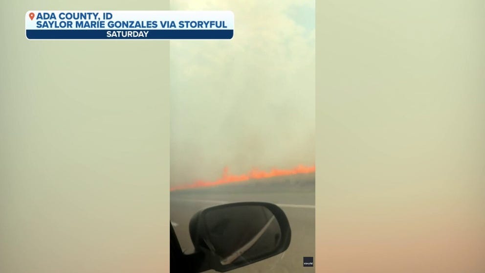 A couple taking a road trip from Denver to Boise had to detour off the highway to escape the flames of a wildfire right along the road on Saturday. 