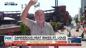 Storm Specialist Mike Seidel cools off in the extreme heat