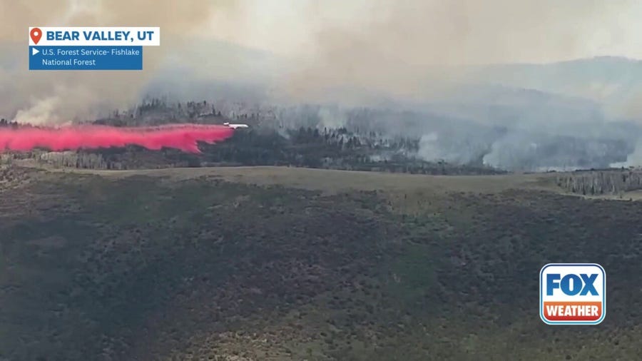 Watch: Plane drops fire retardant on Utah's Monroe Canyon Fire