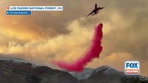 Aircraft drops fire suppressant on Gifford Fire in California