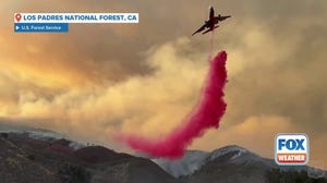 Aircraft drops fire suppressant on Gifford Fire in California