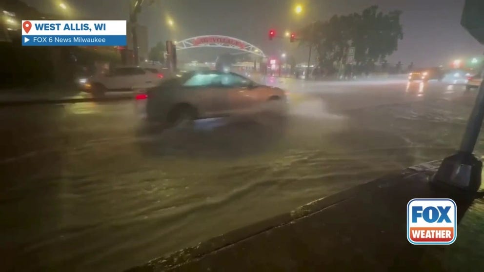 A video shared by FOX 6 News Milwaukee shows vehicles traveling through floodwaters outside the Wisconsin State Fair in West Allis on Aug. 9, 2025.