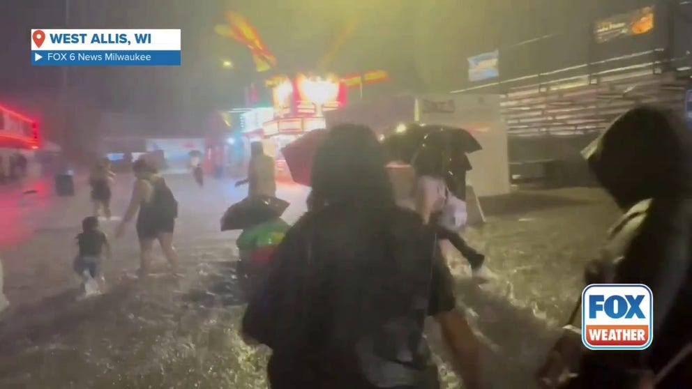 A video shared by FOX 6 News Milwaukee shows children running and playing in water at the Wisconsin State Fair as torrential rain fell on Aug. 9, 2025. Fair officials were forced to close the fair early on Saturday night and said it would remain closed on Sunday due to the flooding.