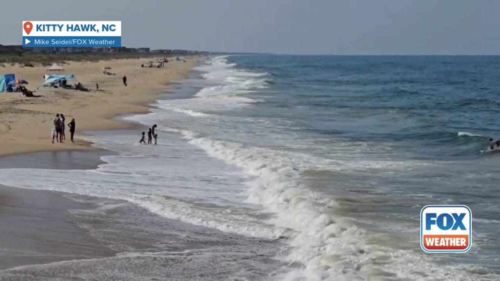 A video shared by FOX Weather Storm Specialist Mike Seidel shows beachgoers enjoying the surf, sand and sunshine in Kitty Hawk, North Carolina, ahead of impacts from Hurricane Erin.