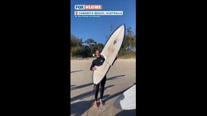 An Australian surfer was lucky to escape in one piece after a shark took a huge bite out of a man's surfboard