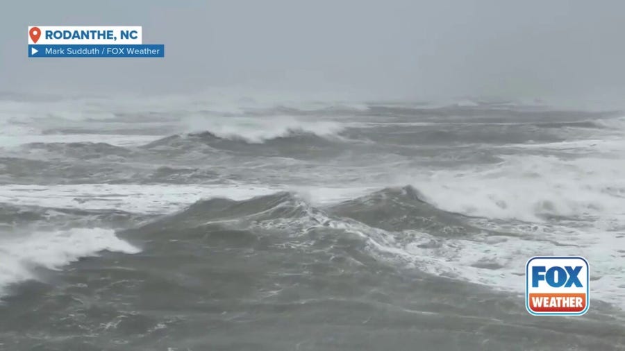 Large ocean swells produced by Hurricane Erin crash against beach in Rodanthe