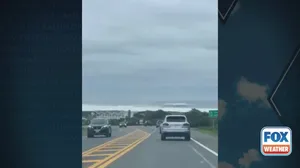 Erin's large waves seen from highway in Montauk, New York