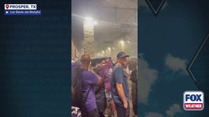 Watch: Texas high school football fans crowd together while seeking shelter from thunderstorms