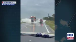 Kansas road floods after storm rolls through
