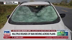 Hail storm leaves damaged car along Nebraska highway