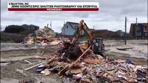 Debris removal crew cleans up home collapse along North Carolina Outer Banks