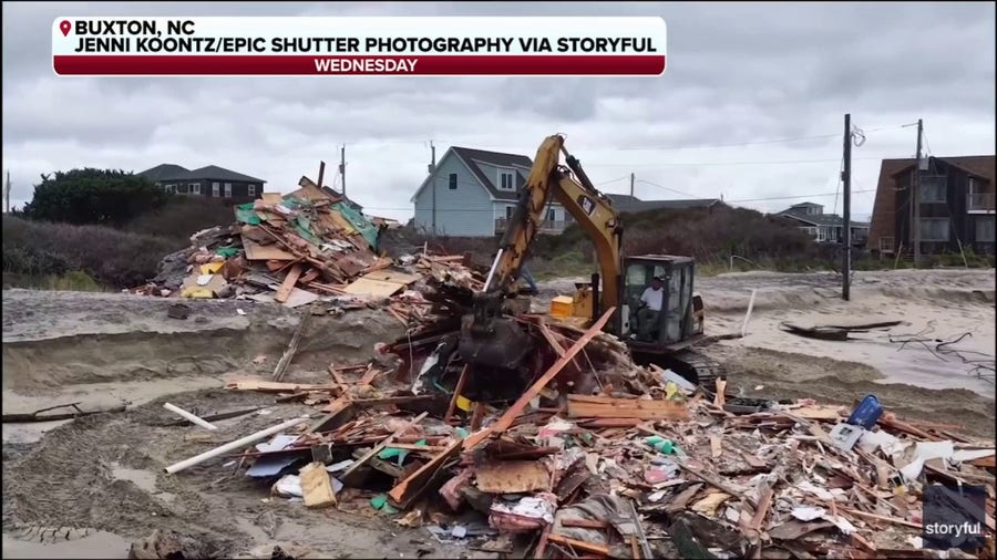 Debris removal crew cleans up home collapse along North Carolina Outer Banks