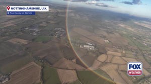 Skydivers capture beautiful full rainbow moment