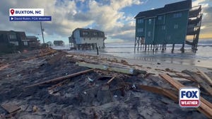 Debris litters Buxton, North Carolina after homes collapse in rough surf