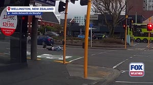 Woman shoved into oncoming traffic by powerful wind in New Zealand