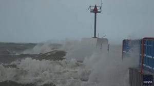 Large waves and strong winds lash at a pier in Lake Michigan
