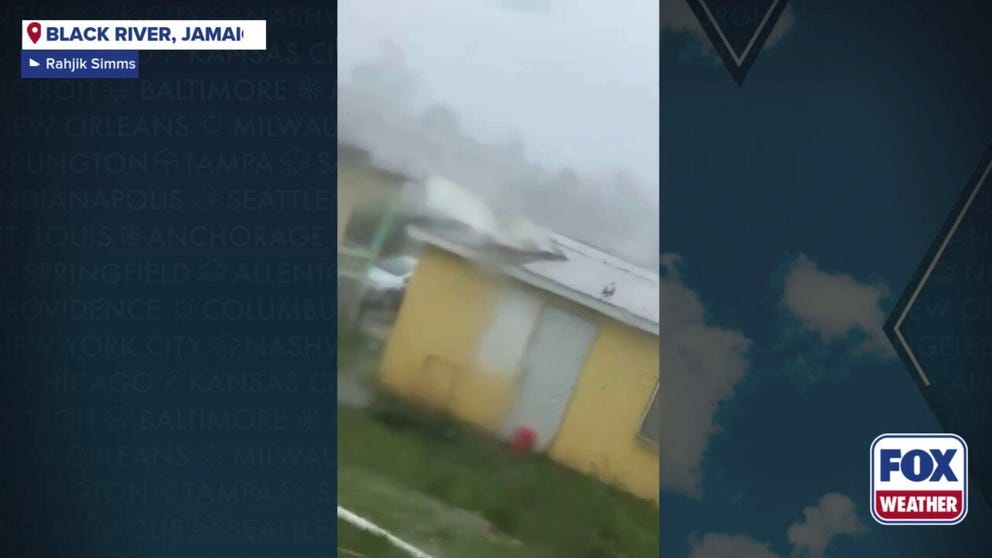 Footage shot on Tuesday shows powerful winds from Hurricane Melissa strong enough to peel back roofs from homes in Black River, Jamaica. The Category 5 hurricane made landfall about 12 miles northwest of Black River.