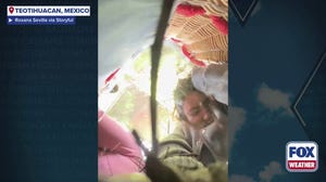 Watch: Hot air balloon riders drift into tree during bumpy landing