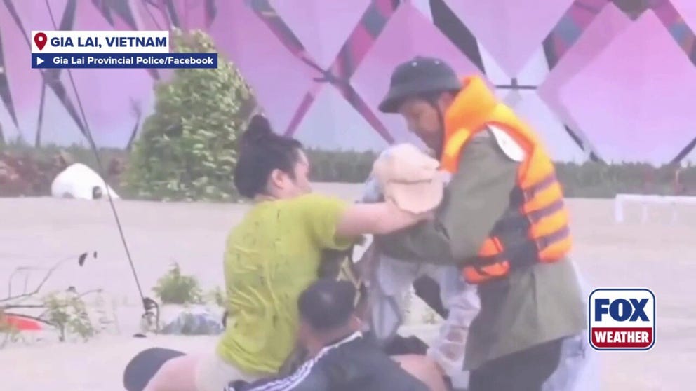 Vietnamese provincial police have released video of an officer saving a baby and mother from deadly floodwaters caused by unrelenting rain that has caused widespread flooding in the country's central highlands that has claimed at least 41 lives.