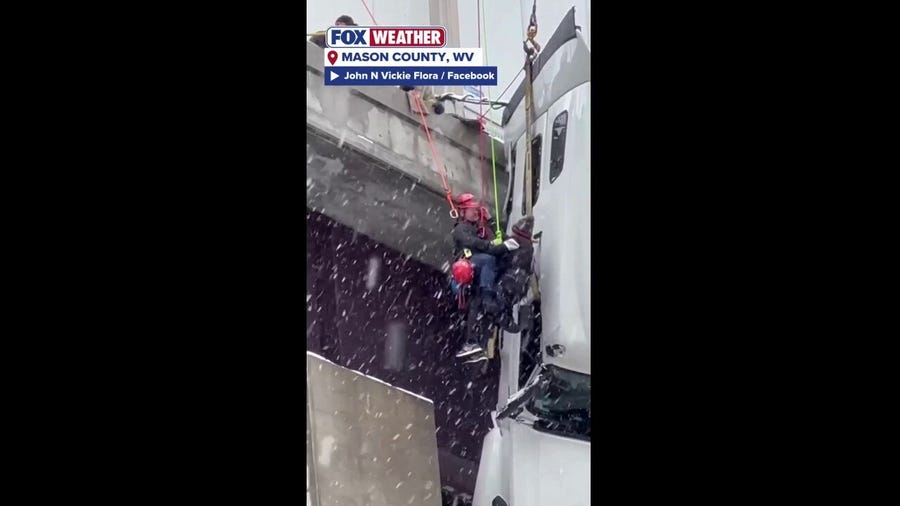 First responders complete a daring rope rescue from atop a bridge