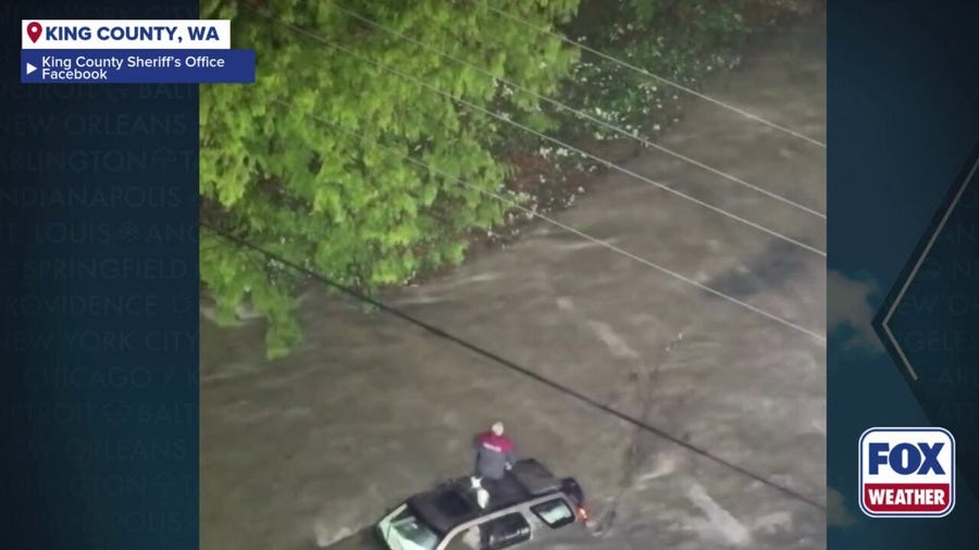 Watch: First responders rescue Washington man from roof of SUV, amid historic flooding