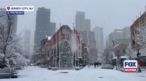 People in Jersey City, New Jersey, experience snowfall