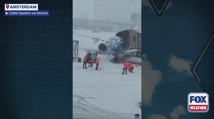 Watch: Airport workers play in snow in Amsterdam amid winter weather