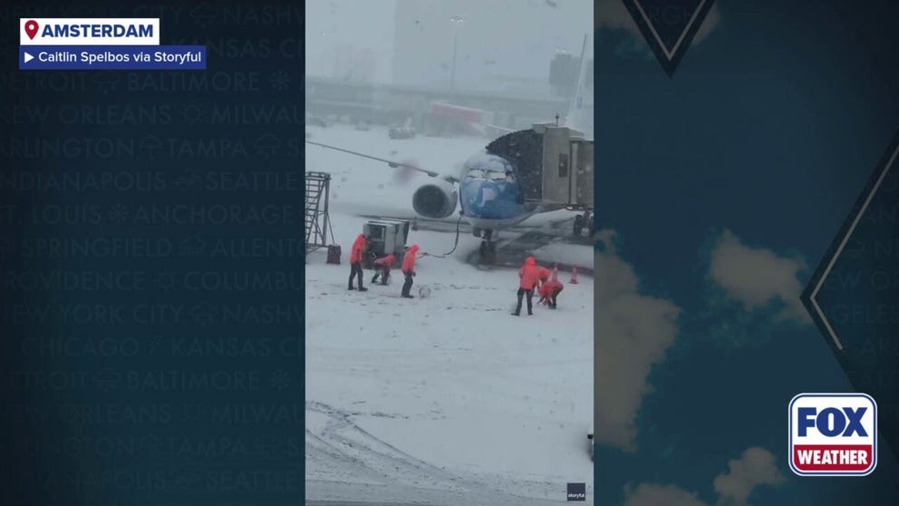 Workers at Amsterdam Airport Schiphol were caught on video having a good time in the freshly fallen snow near some parked airplanes. Hundreds of flights have been disrupted as winter weather continues to impact Europe. 