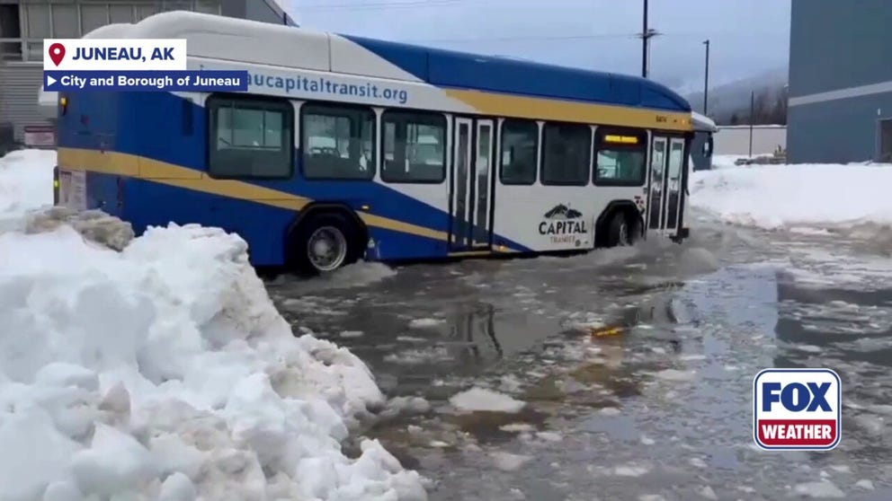 Alaska's panhandle is seeing heavy rain and warmer temperatures, causing heavy snow they received in December to melt, causing flooding. Video shows a Juneau city bus driving through the flooded streets on Wednesday. 