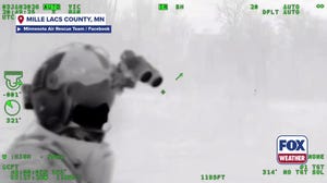 Members of the Minnesota Air Rescue team locate a lost hunter