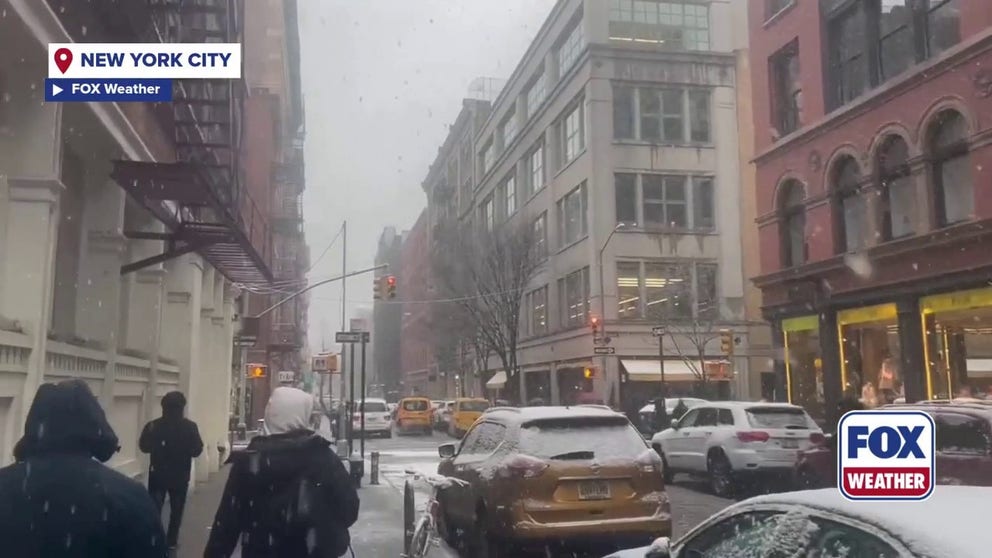 Snow on Saturday made for a messy commute for New Yorkers walking around SoHo. Snow is starting to accumulate in the city, as the video shows cars covered with a light dusting.