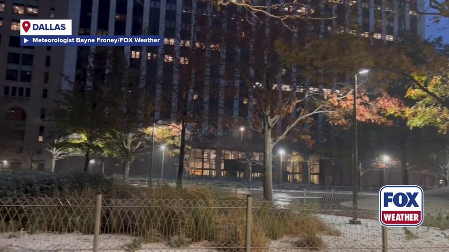 Snow falls across Dallas early Saturday morning