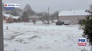 Moderate snowfall blankets a Tennessee neighborhood