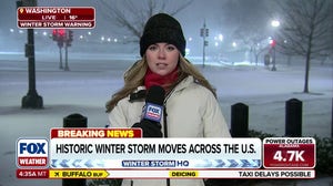 Snow and wind reducing visibility in Washington D.C. as massive storm system moves through Northeast