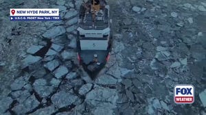 U.S. Coast Guard icebreakers plow through chunks of winter debris