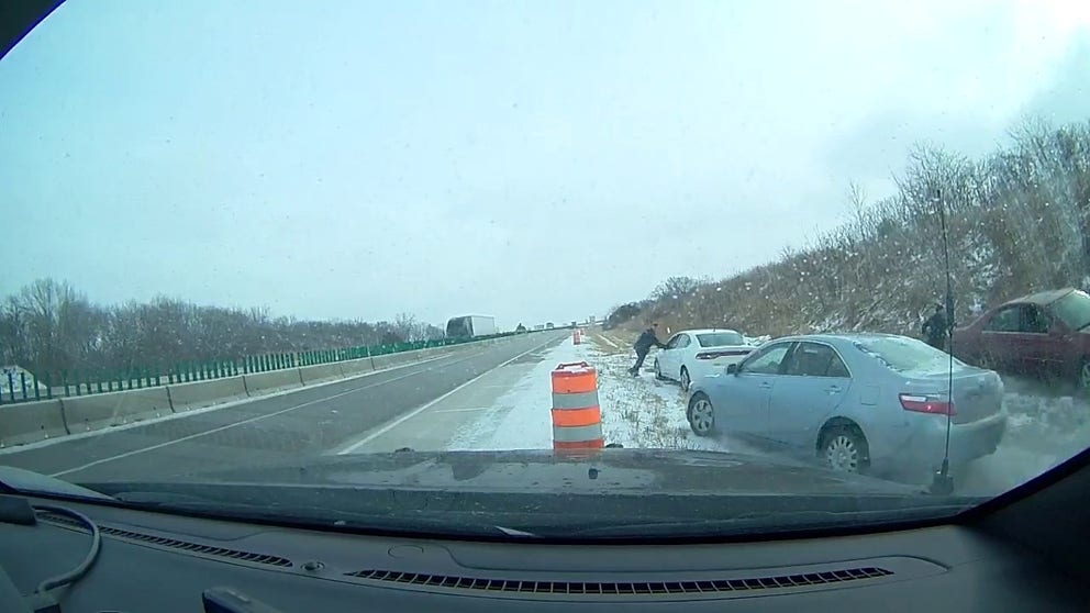 A vehicle that skidded on a major highway in Nebraska almost hit a Nebraska State Patrol Trooper while he was helping a stranded motorist. According to the Nebraska State Patrol, no injuries were reported.  