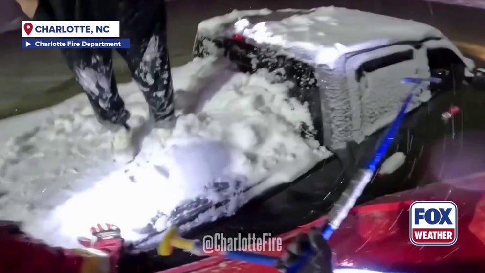 Video from the Charlotte Fire Department shows the moment firefighters rescued a man from a submerged car during this weekend's nor'easter in North Carolina.