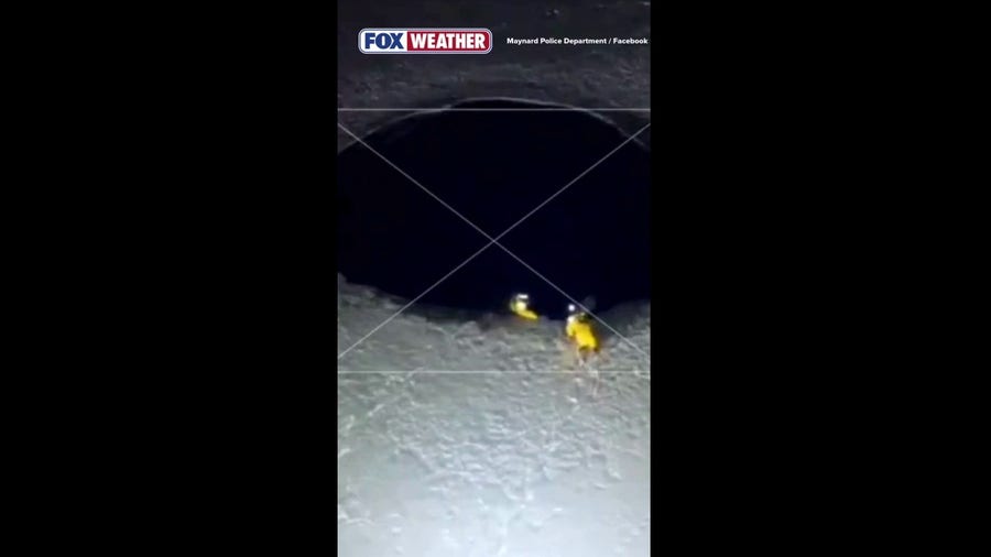 Massachusetts firefighters rescue a dog from frozen pond.