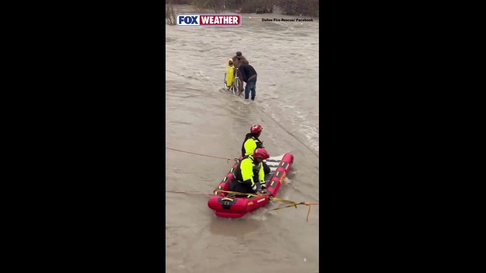 Dallas Fire-Rescue carried out a swift water rescue Saturday when two men and their bike became trapped on a trail by the rising waters of Cottonwood Creek. The crew was able to bring them back to safety.