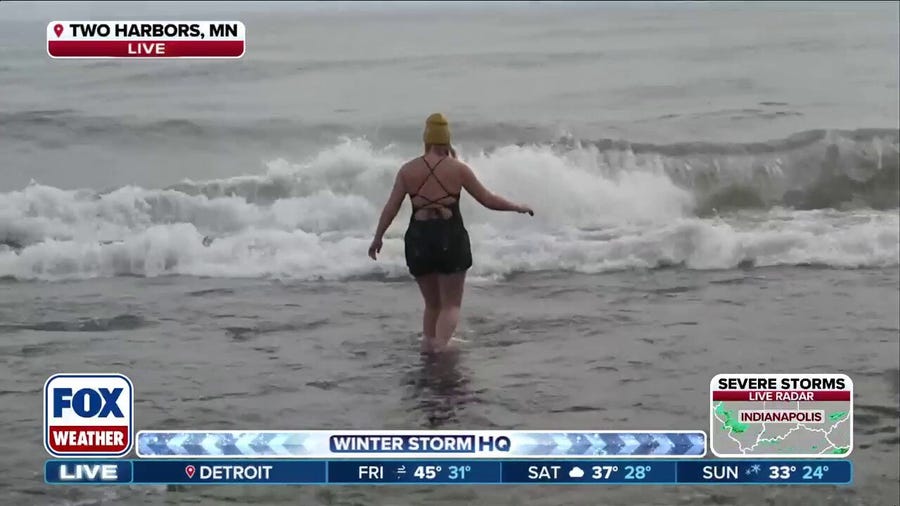Woman does cold plunge in Lake Superior as blizzards slam Midwest