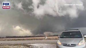 Rotating wall cloud looms near Carlisle, Indiana as severe storms rumble through Ohio Valley