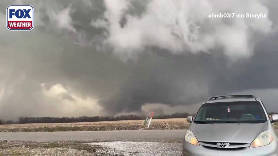 Rotating wall cloud looms near Carlisle, Indiana as severe storms rumble through Ohio Valley