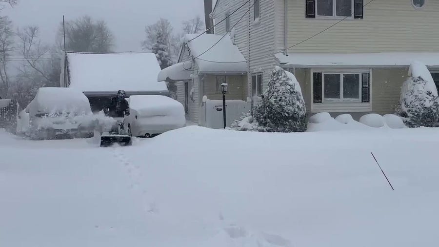 New Jersey residents clear heavy snow accumulations
