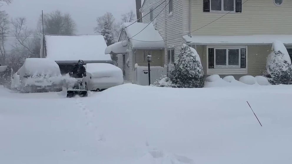 Residents in Wyckoff, New Jersey, clear away heavy snow accumulations.