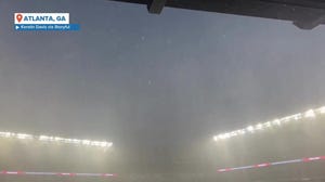 Torrential rains, hail slam Atlanta's Truist Park Friday triggering rain delay
